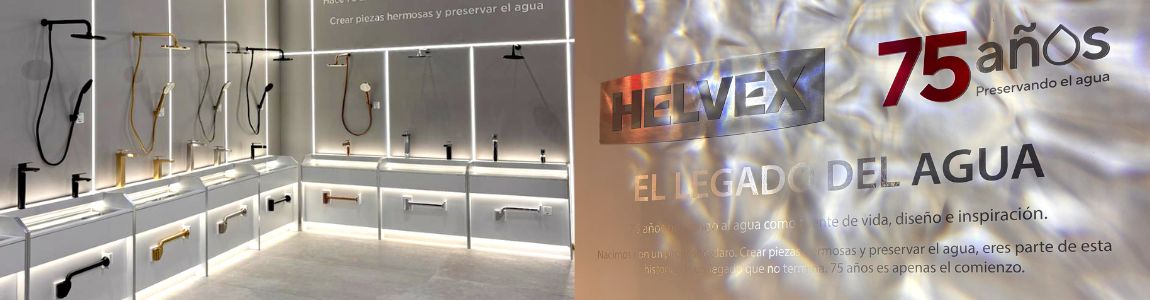 Innovaciones de grifería y accesorios para baño en diversos acabados en un stand de Obra Blanca 2025 con fondo gris con luces frías